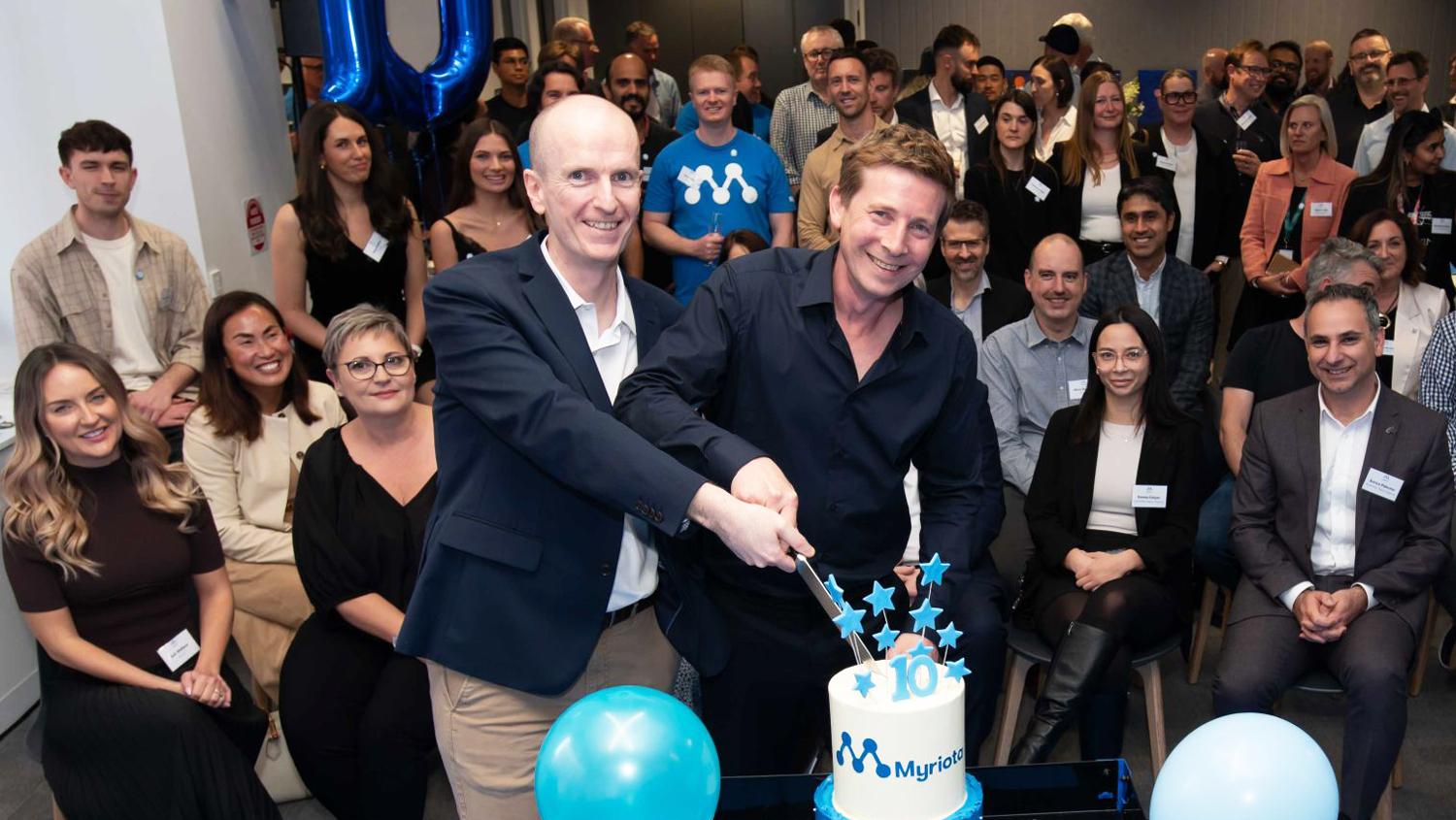 David Haley (left) and CEO Ben Cade cut 10th birthday cake