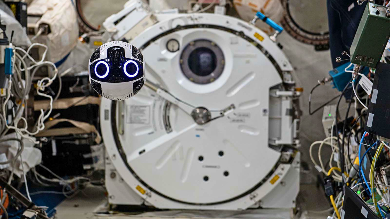 A free-flying robot through the ISS module. Credit: JAXA