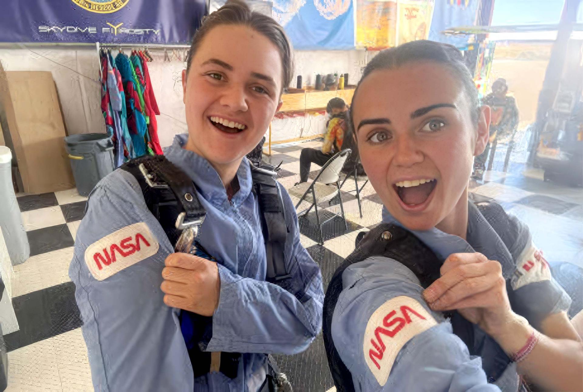 ATSF x Monash University Scholarship recipient Keira Moran (right) skydives in a NASA jumpsuit alongside fellow National Indigenous Space Academy participant and Nyul Nyul woman Madison Wright.